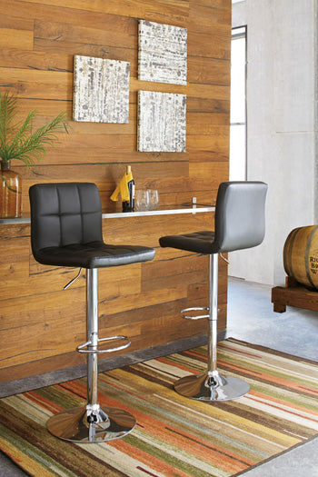 Ashley Homestore |Tall UPH Swivel Barstool